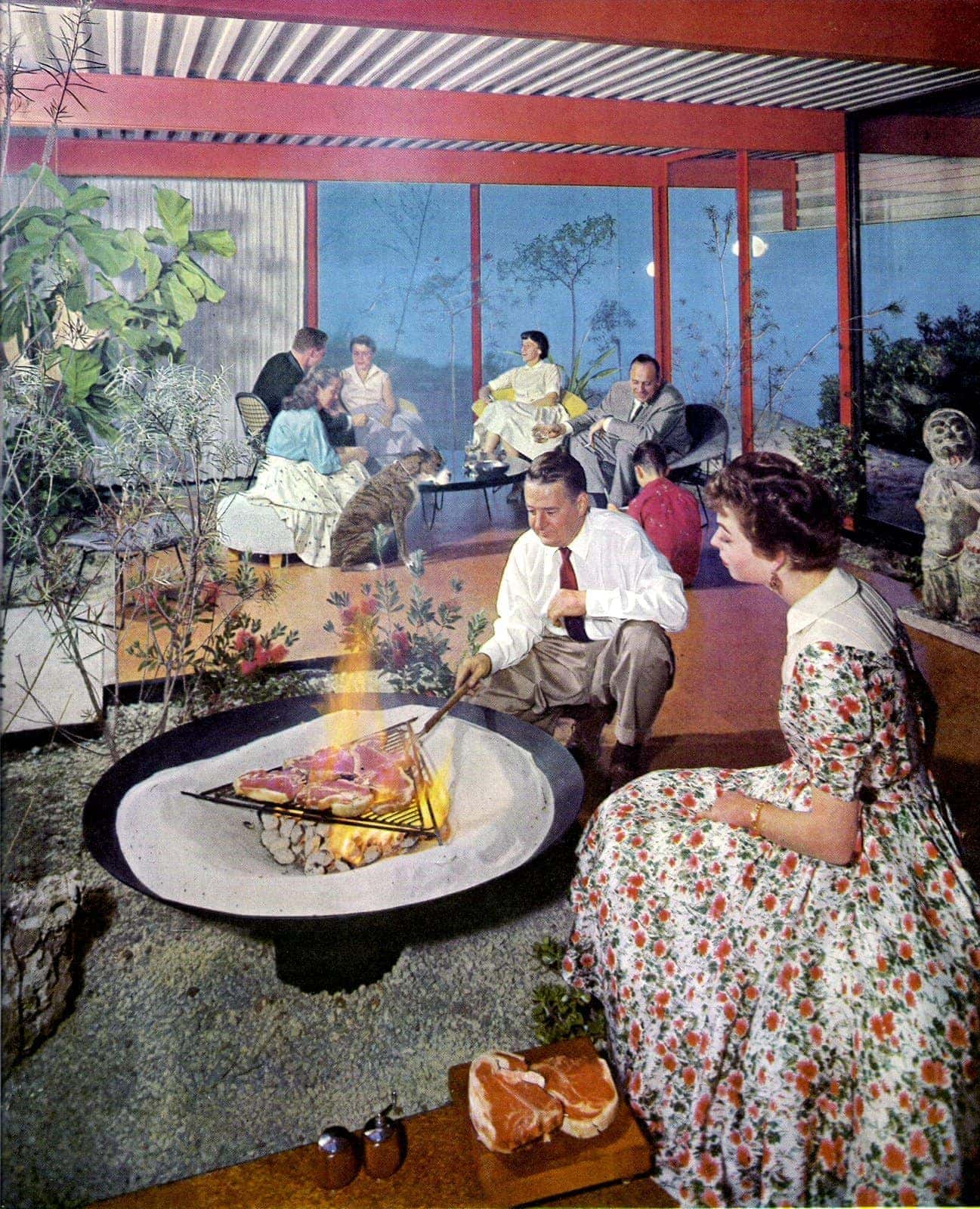 A party-style backyard from the 1960s with a covered porch and BBQ pit