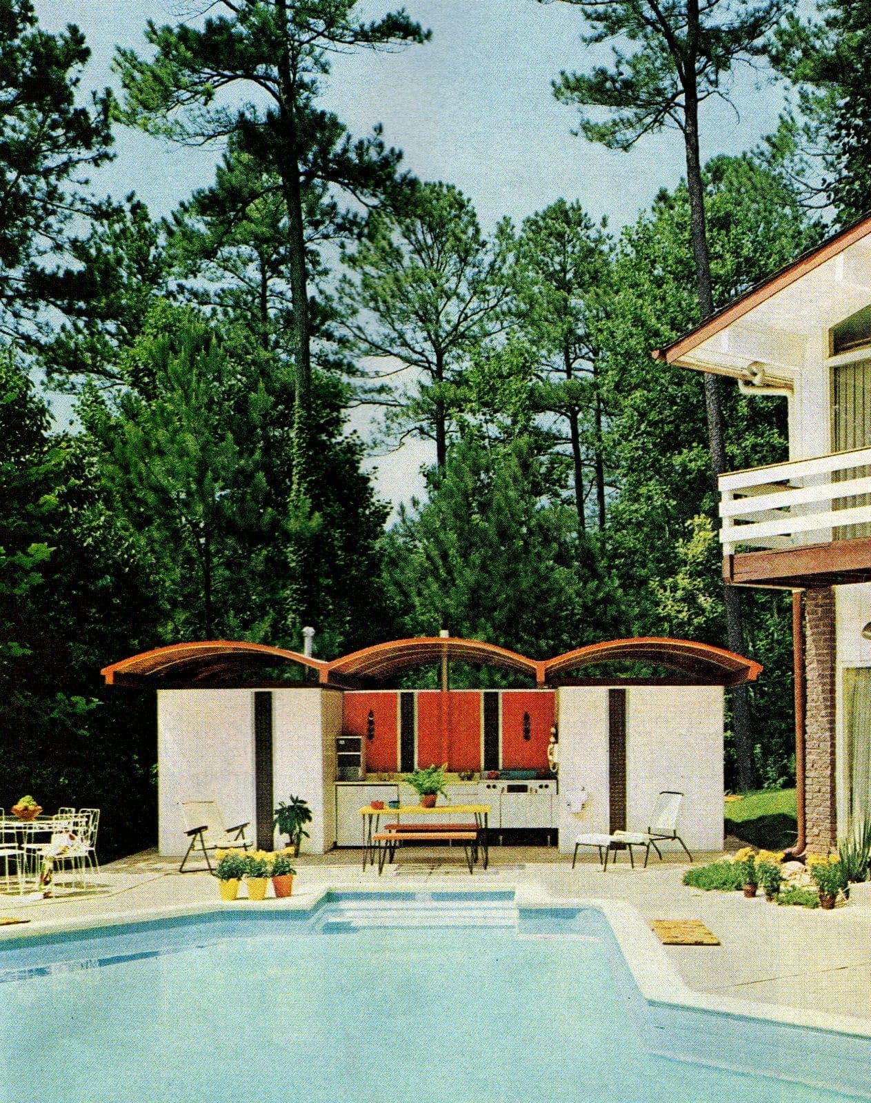 Backyard pool area with outdoor kitchen - vintage home style from 1967