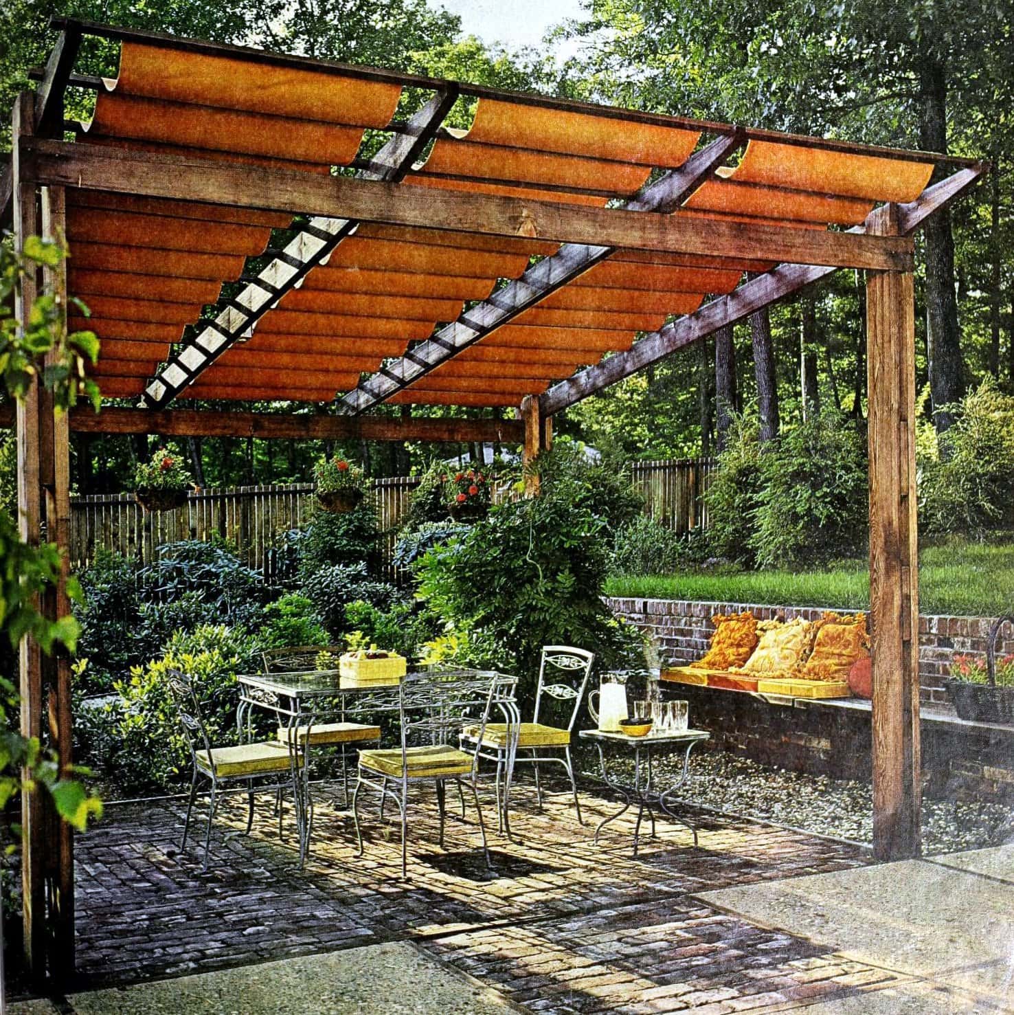 Backyard trellis with fabric covering above an old brick patio (1967)