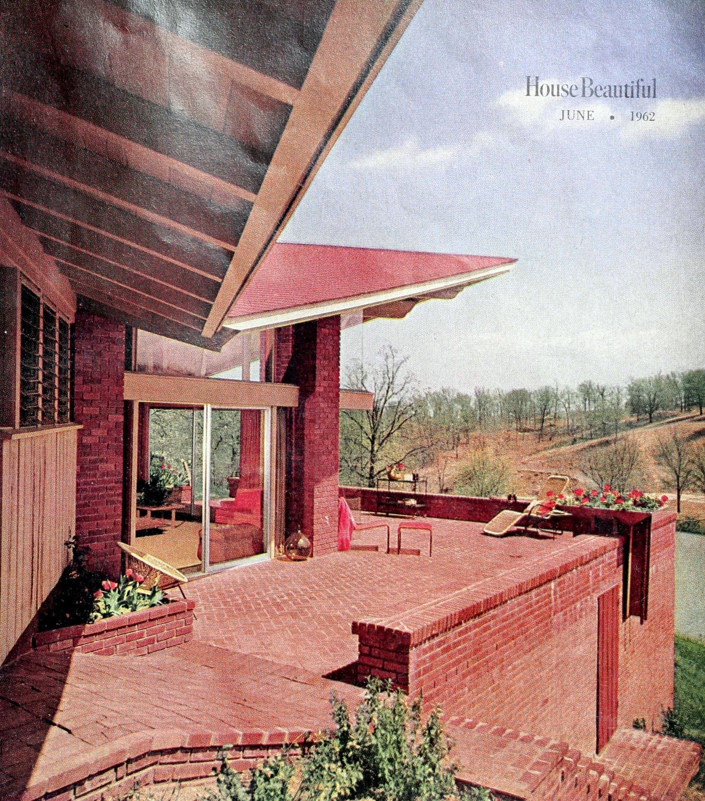 Brick terraced backyard and decking, with angled views of the home (1962)