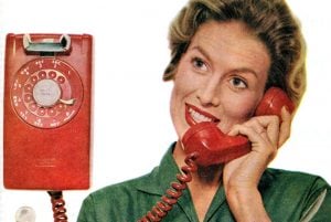 How do you use a rotary-dial phone