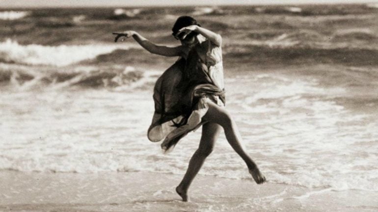 Isadora Duncan dancing on the beach