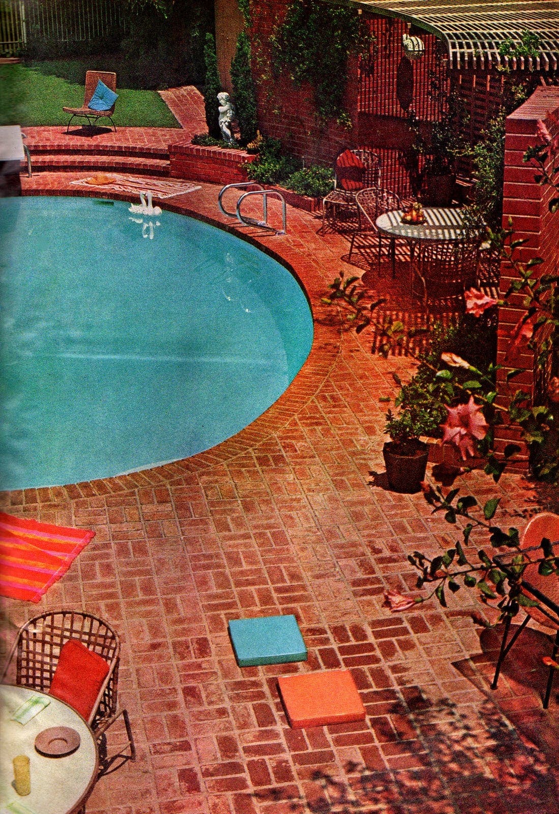 Pretty brick patio deck around a circular pool in the backyard - Vintage landscaping from 1966